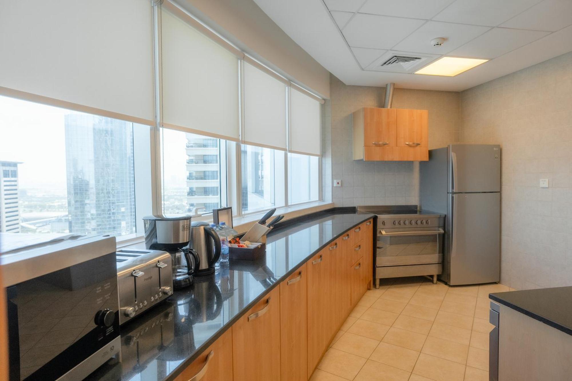 Tamani Marina Hotel & Apartments Dubai Exterior photo A typical kitchen in a modern office